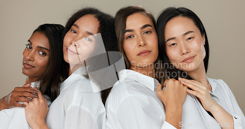 Image of Women, face and skincare, group diversity with love, support and happy friends in portrait for cosmetics on a studio background. Young people smile together and hug for dermatology, beauty and makeup