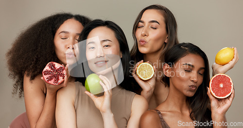 Image of Women, portrait and beauty, diversity and fruit with dermatology and friends on studio background. Unique skin, natural cosmetics and inclusion, eco friendly skincare, smile and citrus for vitamin c