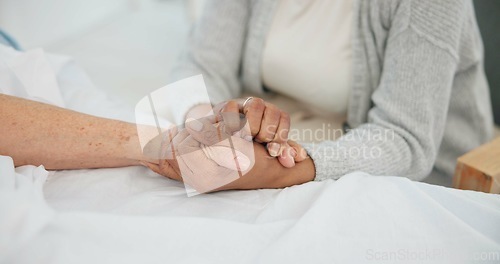 Image of Senior couple, support and holding hands in hospital with love and care at clinic. Elderly patient, kindness and marriage with trust and healthcare with medical help and homecare with empathy