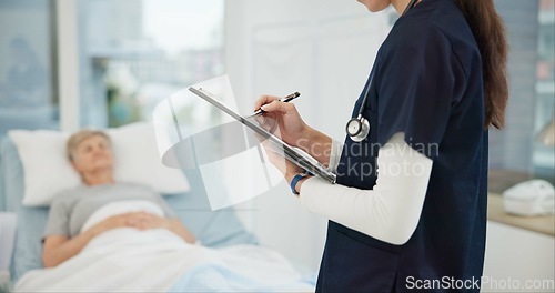 Image of Checklist, hospital and bed with nurse writing healthcare information, clinic charts and senior patient progress. ADN expert, professional person or doctor hands with clipboard for medical report