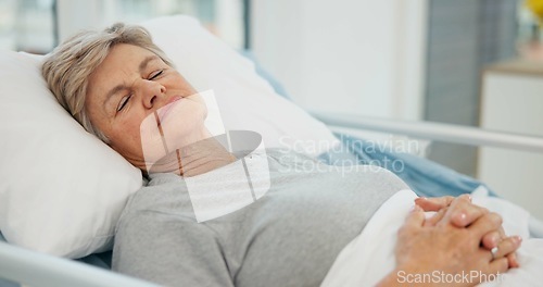 Image of Hospital, sleep and senior woman in bed for recovery, resting and relaxing after surgery treatment. Healthcare, clinic and elderly female person with eyes closed for medical care, service and help