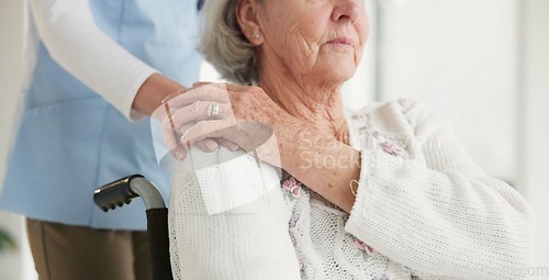 Image of Nurse, senior woman and wheelchair for holding hands, care or support for rehabilitation in clinic. Medic, elderly person with disability or mobility for empathy, kindness or solidarity in retirement