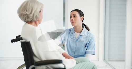 Image of Medical, wheelchair and a woman nurse talking to a senior patient with a disability in a clinic. Healthcare, retirement and support with a female medicine professional talking to a resident at home