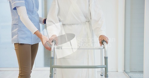 Image of Nurse, senior woman and walker for helping hand, show support and guide in rehabilitation at clinic. Caregiver, elderly person with disability and mobility frame with empathy, physiotherapy and care