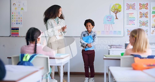 Image of Class paper, presentation and child speaker with applause and cheering in classroom at school. Young kid, education and oral reading of project with student and teacher with children group discussion