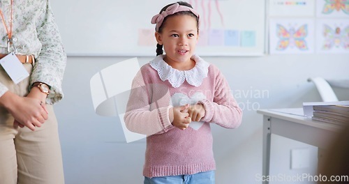 Image of Girl child, classroom presentation and speech for oral assessment with teacher, development and language. Shy female kid, story and speaking for test, exam and education in class, school or academy