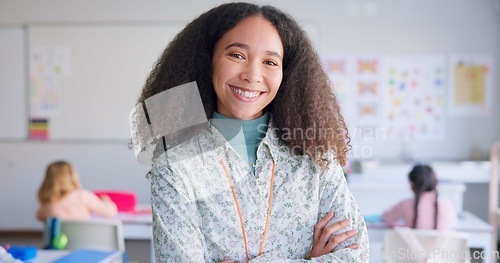 Image of Female teacher, arms crossed and smile in class with school kids, pride or happy for education career. Woman, classroom and learning expert for children, face or portrait with development for future