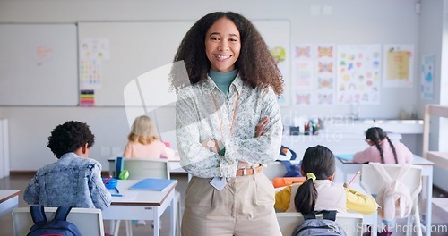 Image of Teacher woman, arms crossed and smile in class with school kids, pride or happy for education career. Academy, classroom and learning expert for children, face or portrait with development for future