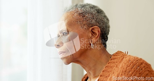 Image of Senior woman, face and thinking by window at home to remember memory and relax in retirement. Serious black elderly person or old lady at nursing facility with hope, sad emotion and Alzheimer disease
