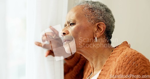 Image of Senior woman, face and thinking by window at home to remember memory and relax in retirement. Serious black elderly person or old lady at nursing facility with hope, sad emotion and Alzheimer disease