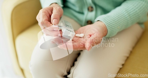 Image of Medicine, pills and hands of old woman on sofa for prescription, medical and supplements. Healthcare, wellness and vitamins with closeup of person in living room at home for pharmacy and retirement