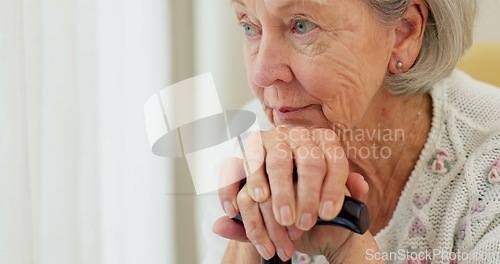 Image of Senior woman, thinking and cane on home sofa to remember memory and relax in retirement. Serious or sad elderly person or old lady with a disability at nursing facility with Alzheimer and arthritis