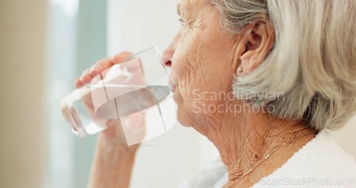 Image of Healthy, hydration and senior woman drinking water for wellness and liquid diet detox at home. Thirsty, fresh and calm elderly female person enjoying glass of cold drink in modern retirement house.