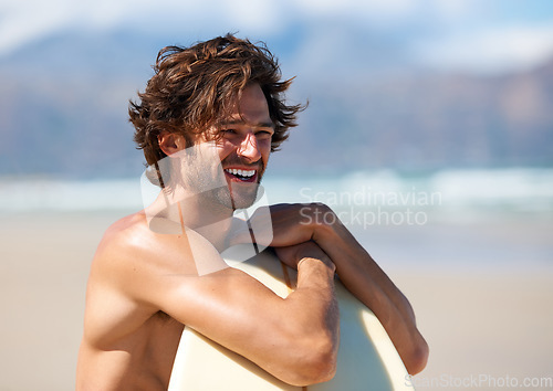 Image of Beach, sports man and surfer smile for wellness activity, training and looking at outdoor wellness, freedom or nature. Happiness, surfing tournament or person watch exercise, competition or challenge