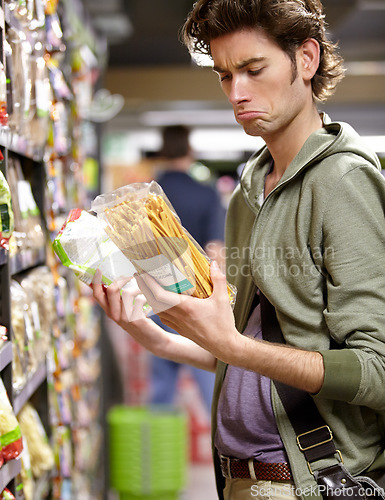 Image of Man, product and comparison choice in supermarket for label difference, nutrition value or grocery shopping. Male person, thinking and decision for shop aisle deal, wholesale price or discount search