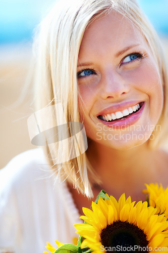 Image of Happy woman, face and thinking with flowers for summer break, eco friendly or vacation in nature. Closeup of female person smile in happiness with plant, outdoor or petal for season change outside