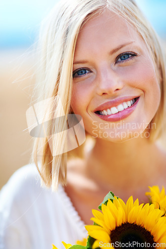 Image of Happy woman, face and portrait smile with flowers for summer break, eco friendly or vacation in nature. Closeup of female person in happiness with plant, outdoor or petal for season change outside