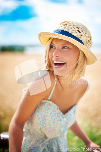 Image of Funny woman on bicycle in the countryside, happiness and travel on journey or thinking outdoor. Smile, bike and excited person laughing at field on transport, freedom and cycling in nature in summer