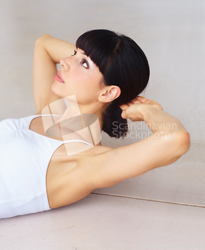 Image of Fitness, sit up or woman training in home for abdominal exercise, activity or strong stomach muscles. Apartment, calisthenics or healthy athlete in body workout routine for abs wellness on floor