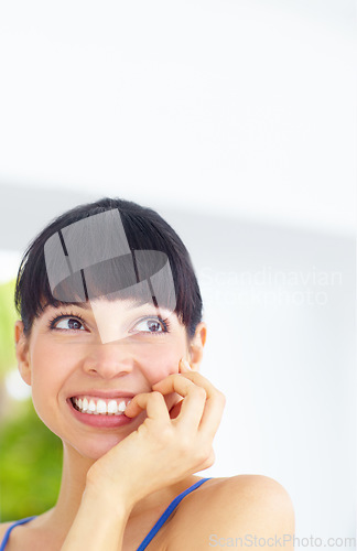 Image of Happy, smile and young woman at her home with positive, good and confident attitude or mindset. Happiness, excited and female person from Canada biting her nail and thinking in her modern house.