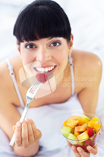 Image of Fruit salad, eating or portrait of happy woman with a morning breakfast or lunch diet in home. Smile, gut health or healthy vegan girl with fruits, snack or food bowl meal to lose weight or wellness