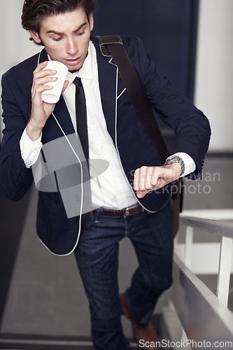 Image of Coffee, fashion and young man by staircase with a watch checking the time for being late. Latte, walking and handsome male person with casual, formal and classy style for professional career.