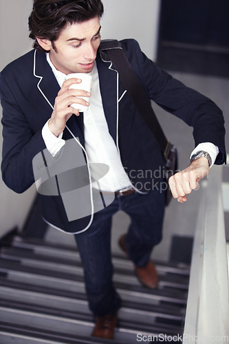Image of Coffee, fashion and young man by staircase with a watch checking the time for being late. Latte, walking and handsome male person with casual, formal and classy style for professional career.