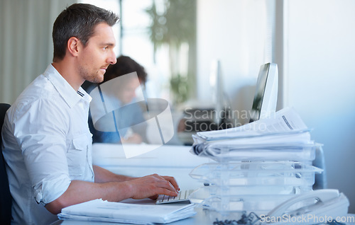 Image of Business man, office and typing on computer for accounting report, budget planning and financial software. Professional accountant or employee on desktop with email management, paperwork or documents