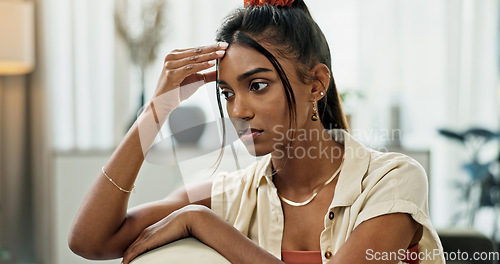 Image of Depression, woman and thinking in home of pain, mental health and anxiety of debt, challenge or mistake. Stress, doubt and confused indian girl with headache of trauma, broken heart or burnout crisis