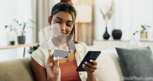 Image of Woman, credit card and phone on sofa, check and reading with cybersecurity, fintech and bank info in home. Girl, smartphone and payment with password, budget or online shopping on e commerce website