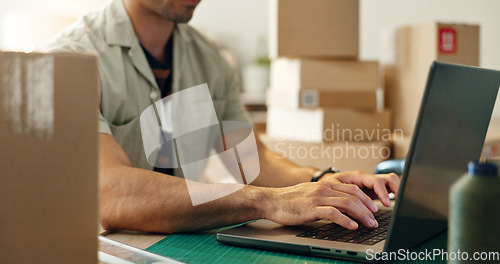 Image of Man, laptop and hands typing in logistics, small business or supply chain for online order or delivery at office. Closeup of male person or employee working on computer and boxes for delivery at shop