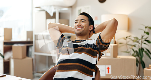 Image of Happy man, smile and relax in satisfaction in office at logistics, shipping or distribution company. Asian person, entrepreneur or worker with excitement at desk for customer orders, profit or sale
