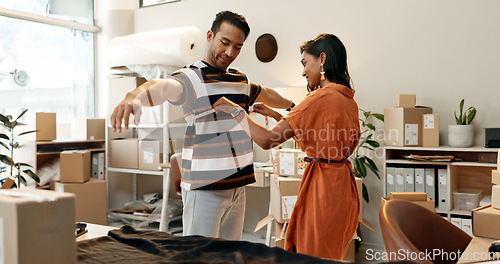 Image of Fashion, designer and tape with a man in store for measurement, planning or fabric fitting. Indian woman, tailor or employee checking a customer for small business, boutique or clothes manufacturing