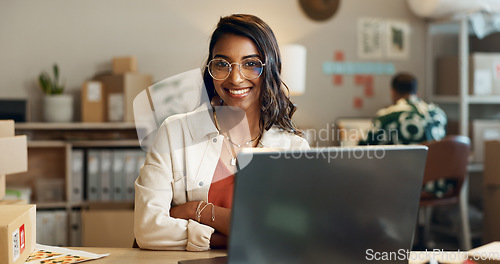 Image of Woman, portrait and laptop, ecommerce and logistics, courier company with shipping and small business owner. Website, digital inventory list and delivery with smile in office, supply chain and retail