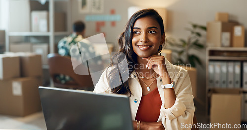 Image of Business, woman or thinking with laptop in office for research, feedback and supply chain for email. Indian, person or ideas for logistics, stock administration or package distribution data at job