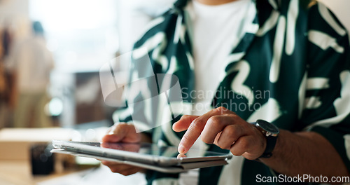 Image of Man, hands and tablet of fashion designer in research, communication or networking at boutique. Closeup of male person on technology for online search, order or inventory inspection in retail store