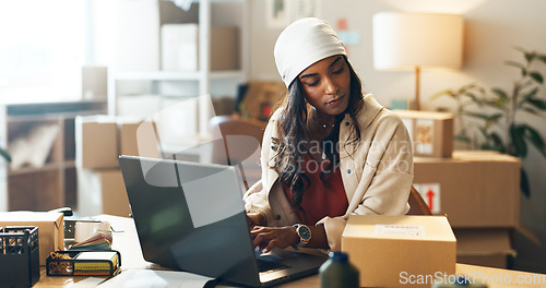 Image of Woman, laptop and small business in logistics with box for order, ecommerce or pricing at boutique. Female person or fashion designer on computer for inventory, storage or inspection at retail store