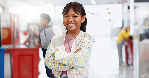 Image of Young, child and exhibition with happy portrait for education, kindergarten and kid learning with toys. Girl student, face and smile to study or develop, excited and science play for problem solving