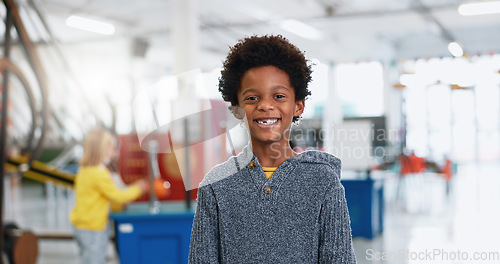 Image of Portrait, boy and child with education for science, convention or exhibition with smile and confidence. Face, student and kid with happiness at scientific tradeshow, workshop or academy for knowledge