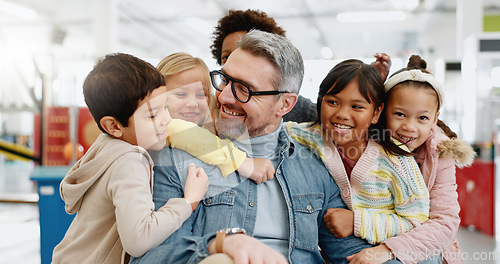 Image of Hug, children and male teacher with happiness, smiling and excited for bonding, friends and education. Kids, embrace and memories for girls, boys and diversity in classroom, together and knowledge