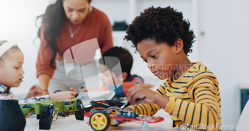 Image of Technology, boy and car robotics at school for learning, education or electronics with car toys for innovation. Classroom, learners and transportation knowledge in science class for research or study