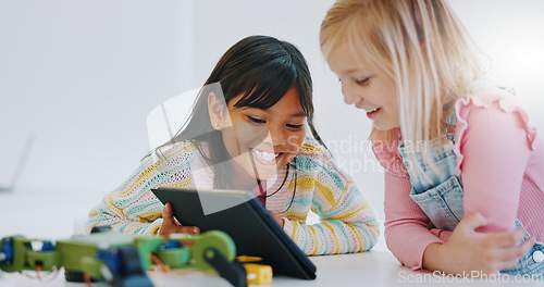 Image of Learning, children and tablet in robotics classroom for engineering, science and technology education. School, teamwork and girls online together with elearning game, problem solving or research