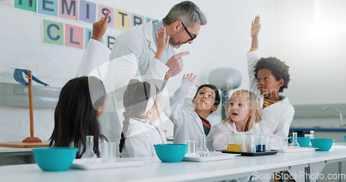 Image of Science, question and students in class with their teacher for learning or to study chemistry. Children, hands raised and education with kids in a laboratory for an experiment of chemical reaction