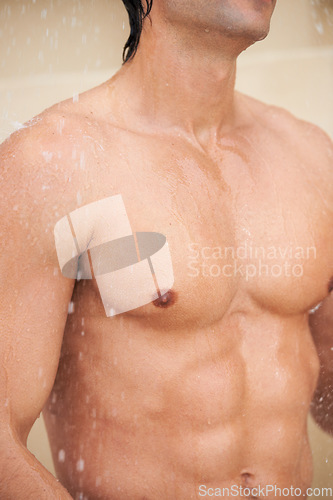 Image of Shower, body and man with water for cleaning, washing and grooming for healthy skin. Beauty, spa treatment and torso of person with splash for hygiene, wellness and skincare hydration and cleanse