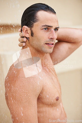 Image of Shower, skincare and man with water for cleaning, washing and grooming for healthy skin. Beauty, spa treatment and person with splash for hygiene, wellness and dermatology hydration and cleanse