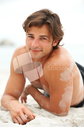 Image of Man, portrait and smile beach sand or relax summer break,.vacation fun or sea holiday. Male person, happy or peace at ocean for fresh air tourism or travel destination, confident or tropical sunshine