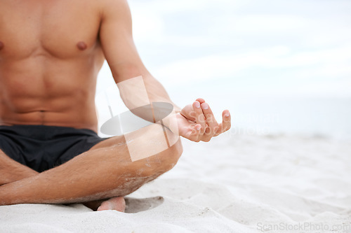 Image of Man, lotus or hand on beach closeup for meditation, zen peace or spiritual practice. Male person, fingers or ocean sand or holistic balance for growth reflection, mind thinking chakra or calm healing