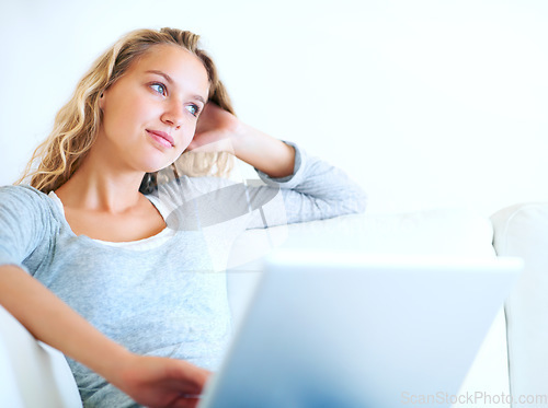 Image of Thinking, laptop and woman on sofa for remote work, planning or dream. Computer, idea and freelance person in living room, decision making or strategy for project, problem solving or solution in home