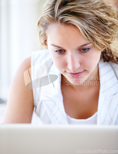 Image of Laptop, typing and woman in home, reading email and remote work to network on internet. Computer, freelance and happy person on social media, website and online communication on digital technology