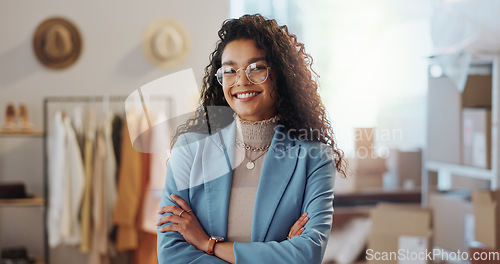 Image of Portrait, happy woman and fashion designer with arms crossed in clothes store or startup. Confidence, face of tailor and business professional, entrepreneur and creative worker in glasses in Brazil